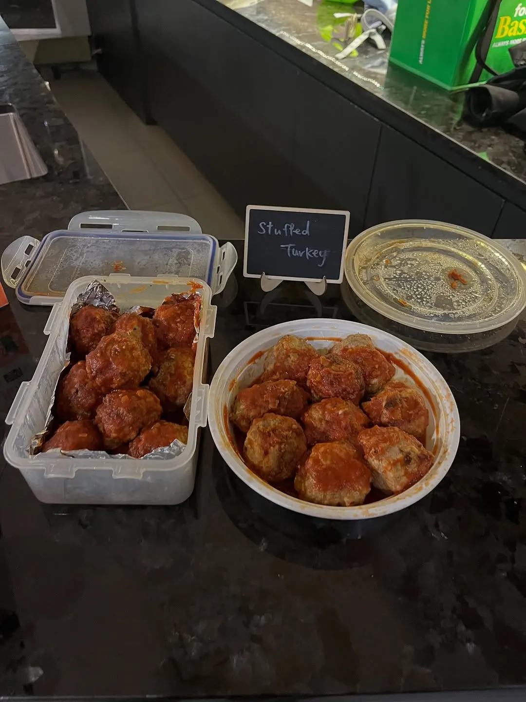 Stuffed turkey meatballs in tomato sauce at the Friendsgiving table.