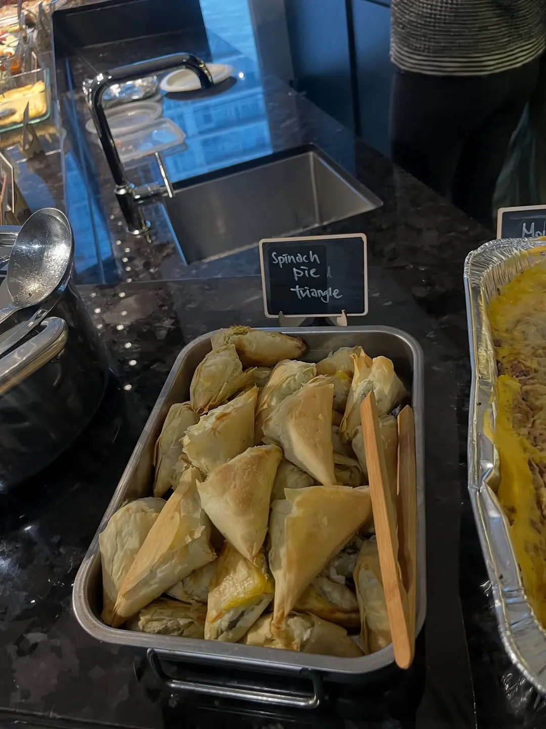 Trays of spanakopita at the Greek night